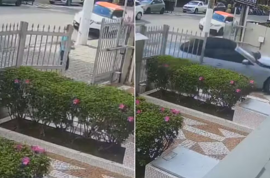 Motorista perde controle de BMW, invade condomínio e pedestre escapa por segundos; veja vídeo